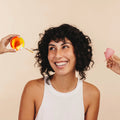 A woman looking at and choosing the Lumma menstrual disc versus other menstrual cups