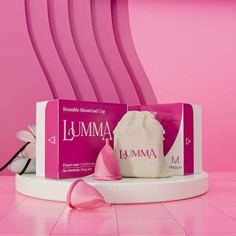 Two Lumma reusable menstrual cups packaging with a pouch on a pink background