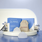 Lumma reusable menstrual disc in the clear color with packaging and pouch