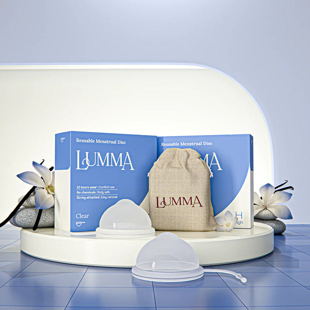 Lumma reusable menstrual disc in the clear color with packaging and pouch
